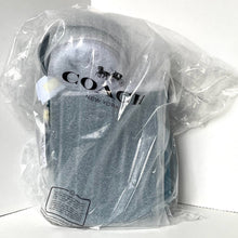 Load image into Gallery viewer, Coach cap in clear plastic packaging on a white background