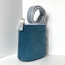 Load image into Gallery viewer, Blue suede handbag with a gray strap on a white background