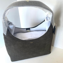 Load image into Gallery viewer, Gray handbag with a white interior on a light background