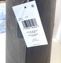 Load image into Gallery viewer, Close-up of a product tag on a gray bag with a barcode and text.