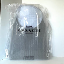 Load image into Gallery viewer, Coach backpack in clear plastic packaging on a white background