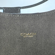 Load image into Gallery viewer, Close-up of a Coach New York logo on a gray leather product.