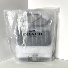 Load image into Gallery viewer, Coach backpack in clear plastic packaging on a white background