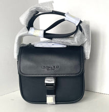 Load image into Gallery viewer, Black Coach bag with silver accents on a white background