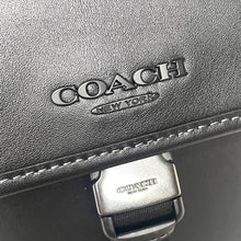 Load image into Gallery viewer, Coach handbag with visible brand logo on a dark background