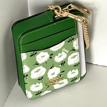 Load image into Gallery viewer, Green wallet with floral pattern and gold zipper on a white background