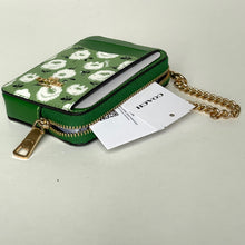 Load image into Gallery viewer, Green patterned handbag with gold chain and tag on a light gray background