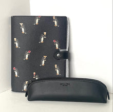 Load image into Gallery viewer, Black planner with penguin pattern and black pencil case on a white background