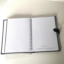 Load image into Gallery viewer, Open notebook with lined pages on a white surface