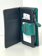 Load image into Gallery viewer, Open black leather wallet with green zipper pull on a white background