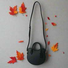 Load image into Gallery viewer, Black handbag with a long strap on a white background