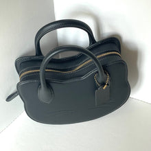 Load image into Gallery viewer, Black handbag with gold zipper on a white background