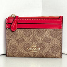 Load image into Gallery viewer, Coach wallet with red top flap on a white background