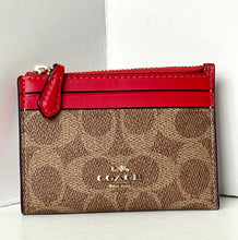 Load image into Gallery viewer, Coach wallet with red top section on a white background