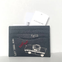 Load image into Gallery viewer, Black leather cardholder with doodles and &#39;Coach&#39; branding on a white background