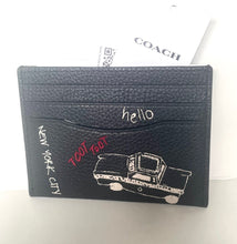 Load image into Gallery viewer, Black leather cardholder with car illustration and text on a white background