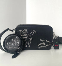 Load image into Gallery viewer, Black wallet with dinosaur design and text on a white background