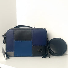 Load image into Gallery viewer, Blue and black patchwork handbag with a round pouch on a white background