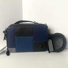 Load image into Gallery viewer, Blue and black patchwork handbag with a matching round pouch on a white background