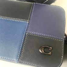 Load image into Gallery viewer, Blue and black leather wallet with a brand logo on a light background
