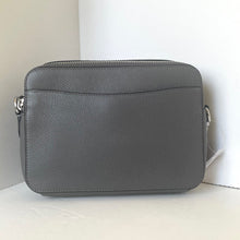 Load image into Gallery viewer, Gray leather crossbody bag on a white surface with a light gray background