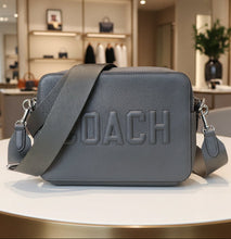 Load image into Gallery viewer, Gray Coach shoulder bag on a white background