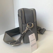 Load image into Gallery viewer, Gray Coach bag with a strap on a white surface