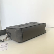 Load image into Gallery viewer, Gray leather bag with a visible brand tag on a light surface