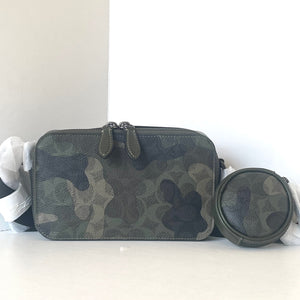 Camouflage-patterned pouch with a round container on a white background