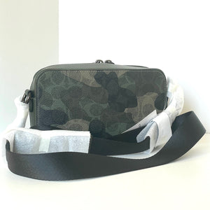 Camouflage-patterned bag with a black strap on a white background