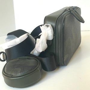 Black travel case with a compartment containing white plastic bags on a white background