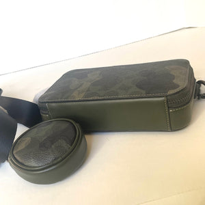 Green leather case with a strap on a white background