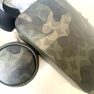 Camouflage-patterned pouch with a round mesh container on a white background