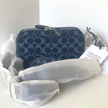 Load image into Gallery viewer, Blue patterned wallet and gray travel pillow on a white surface with a white box in the background.