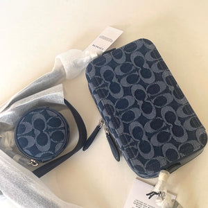 Two blue patterned bags with tags on a light background