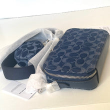 Load image into Gallery viewer, Blue patterned bag with a strap on a white surface