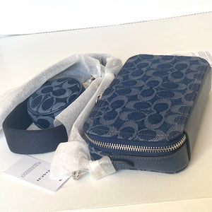Blue patterned bag with a strap on a white surface