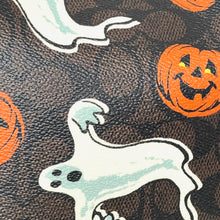 Load image into Gallery viewer, Halloween-themed fabric with ghost and pumpkin designs on a brown background