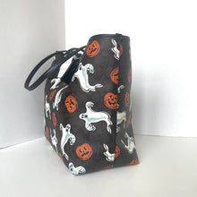 Load image into Gallery viewer, Halloween-themed bag with ghost, pumpkin, and ghost designs on a white background
