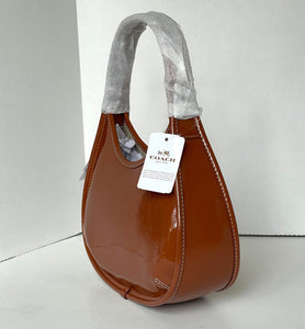 Brown handbag with gray handle on a white background