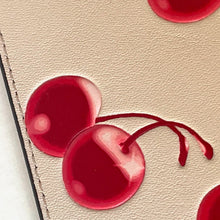 Load image into Gallery viewer, Close-up of red cherries on a beige fabric background