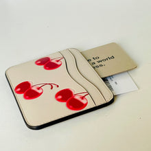 Load image into Gallery viewer, Beige cardholder with red cherries on a white surface