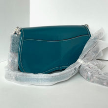 Load image into Gallery viewer, Teal handbag with glittery straps on a light gray background