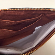 Load image into Gallery viewer, Brown leather wallet with gold zipper on a beige background