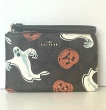 Load image into Gallery viewer, Coach wallet with Halloween-themed design featuring ghosts and pumpkins on a white background