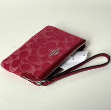 Load image into Gallery viewer, Red wallet with a visible brand logo on a light background
