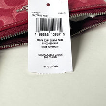 Load image into Gallery viewer, Close-up of a Coach wallet with a price tag on a light gray background