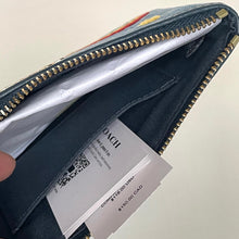 Load image into Gallery viewer, Open blue Coach wallet with a visible brand label on a light background