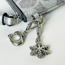 Load image into Gallery viewer, Silver jewelry charms including a ring and leaf design on a white background