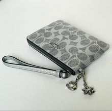 Load image into Gallery viewer, Gray patterned wristlet with silver strap and charm on a white background